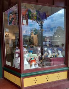 Lisa Wiseman's crochet, sculpture and painting in the front windows of the DAS gallery during March 2024